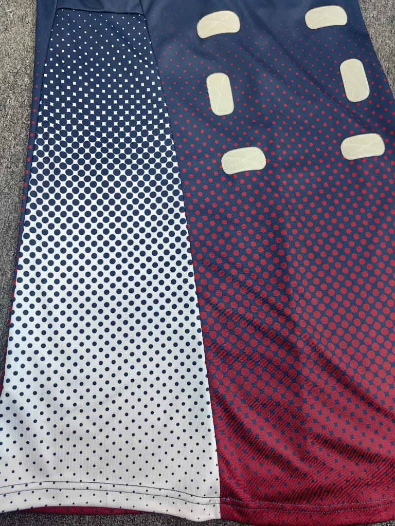 Detailed texture of a garment with vibrant, custom sublimation printing.