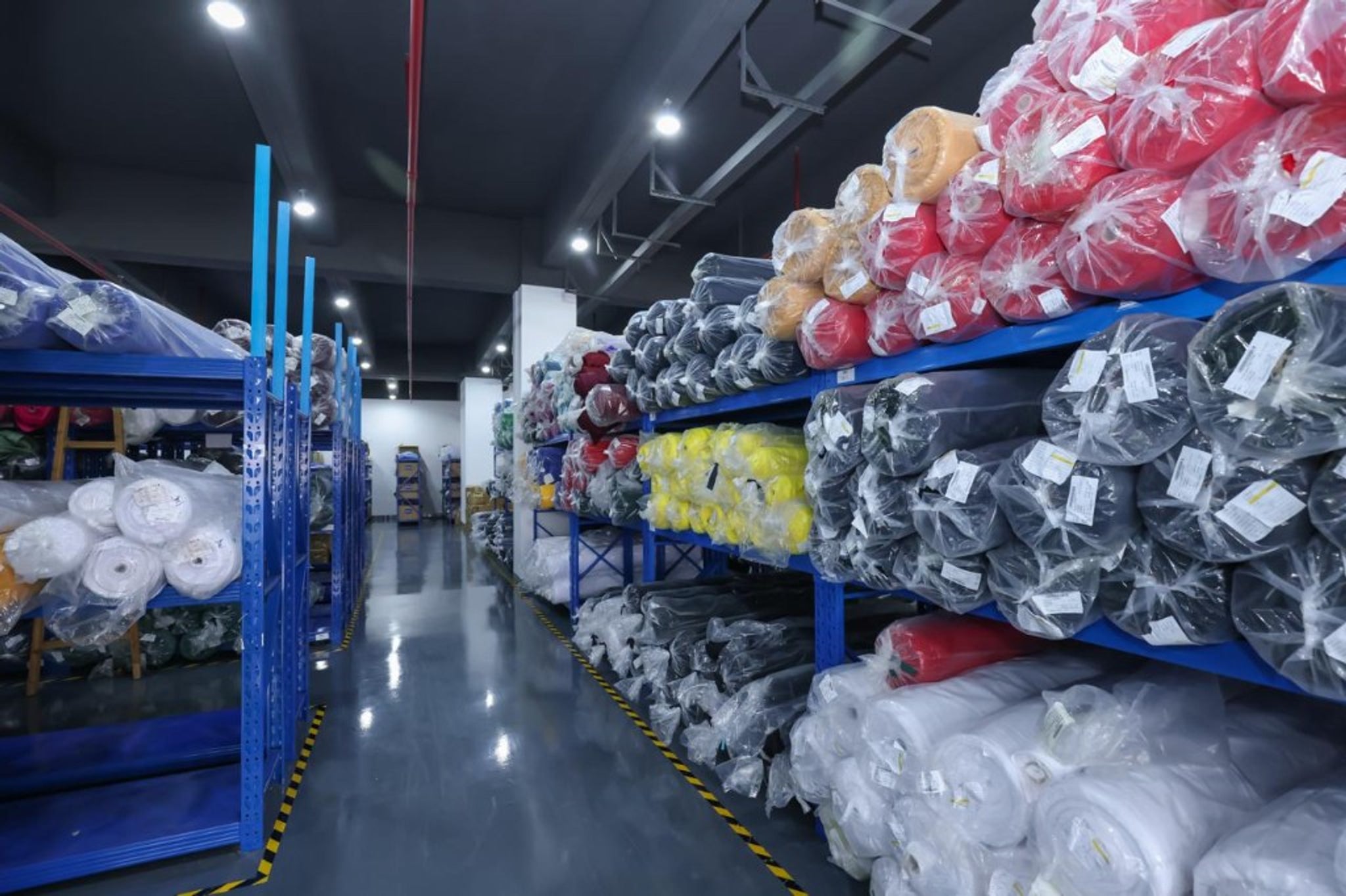 Industrial fabric printing machine manufacturing custom sportswear patterns.