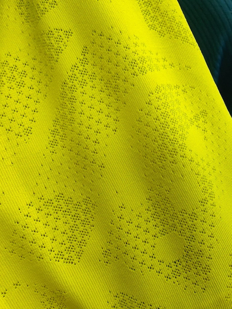 Intricate texture of custom jacquard woven pattern garment fabric.
