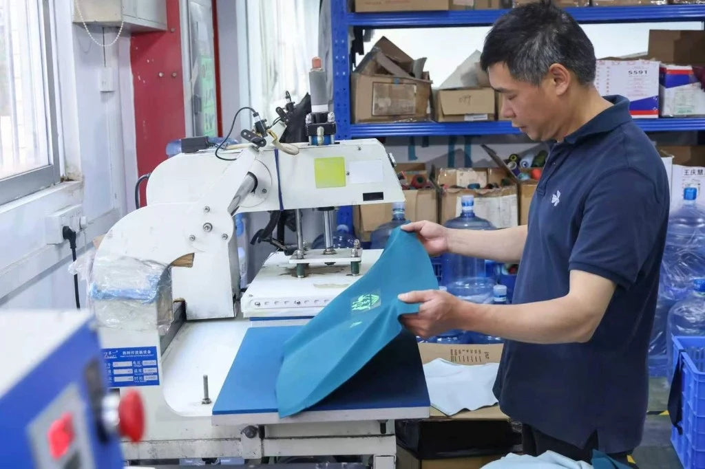 Custom logo heat seal and clothing branding at TALON — TALON OEM manufacturing